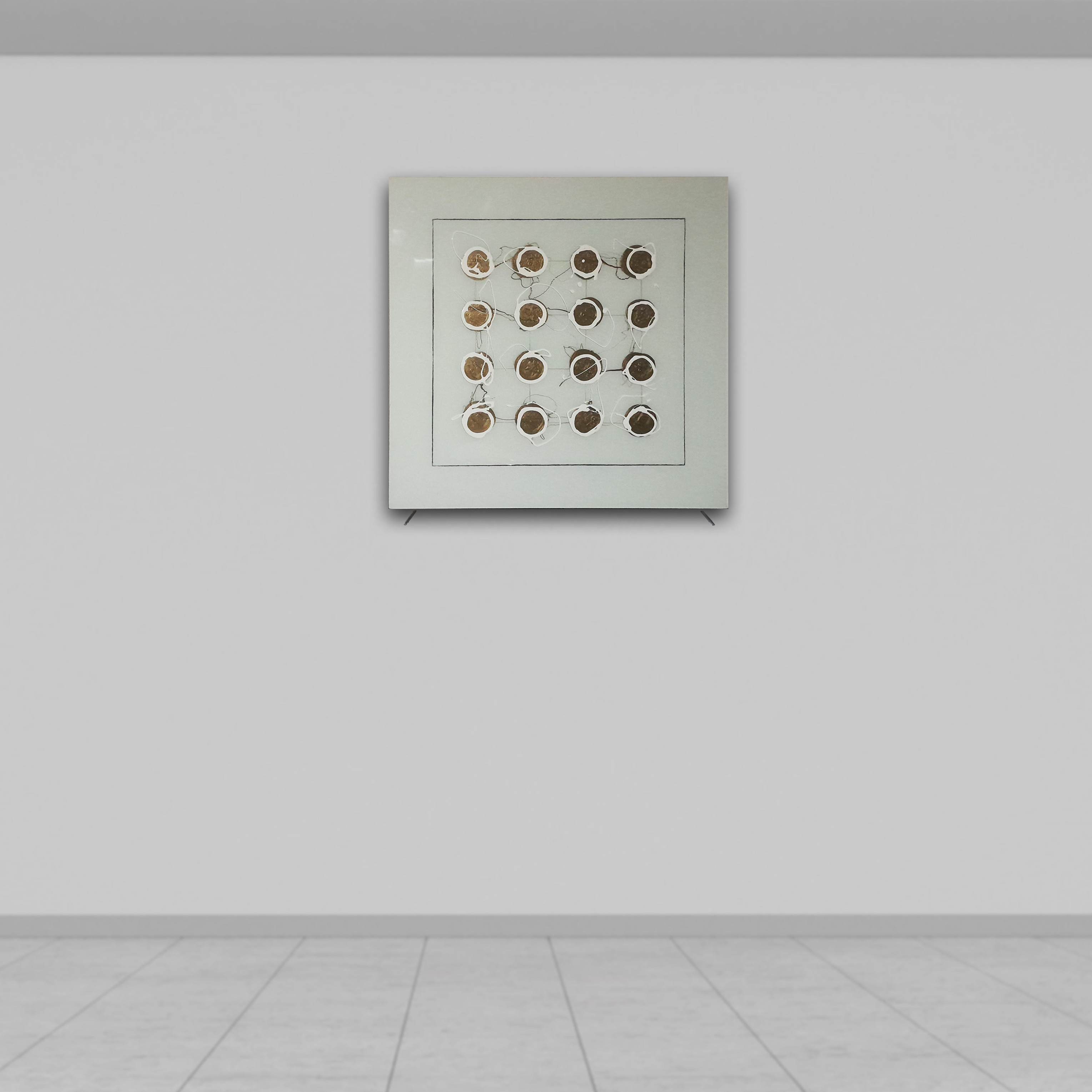 16 Golden dots over white glass